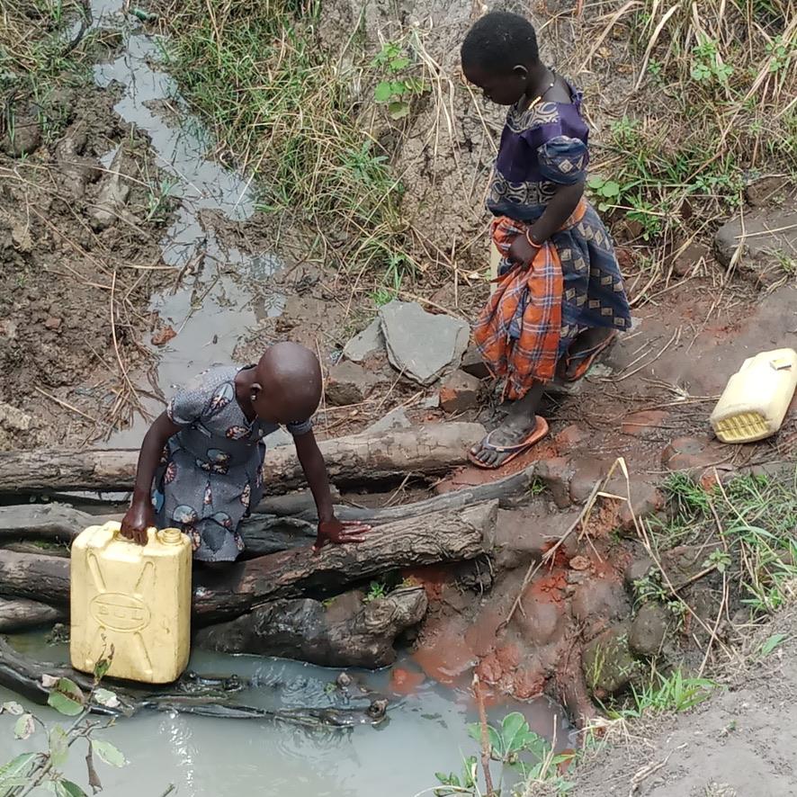 Children collecting water from an unsafe local source