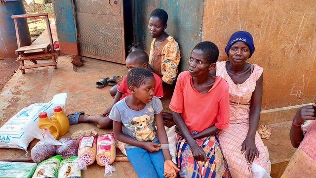 Children and caregivers with food and education supplies